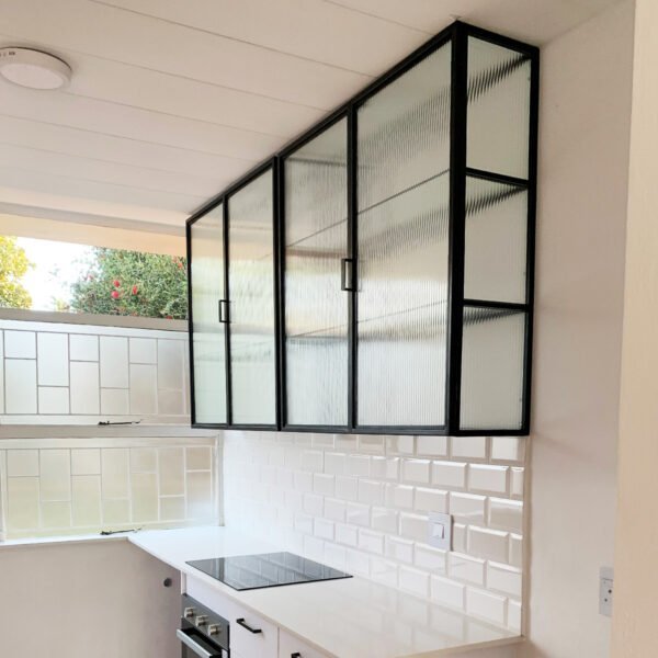 STUDIO DELTA GLASS AND STEEL KITCHEN CABINET IN BLACK